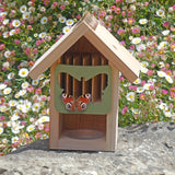 Butterfly Barn, wooden structure with butterfly-shaped entrance, attached to a tree trunk, copper roof detail, surrounded by natural greenery and flowers, butterfly resting on the entrance, eco-friendly pollinator shelter, ideal for gardens