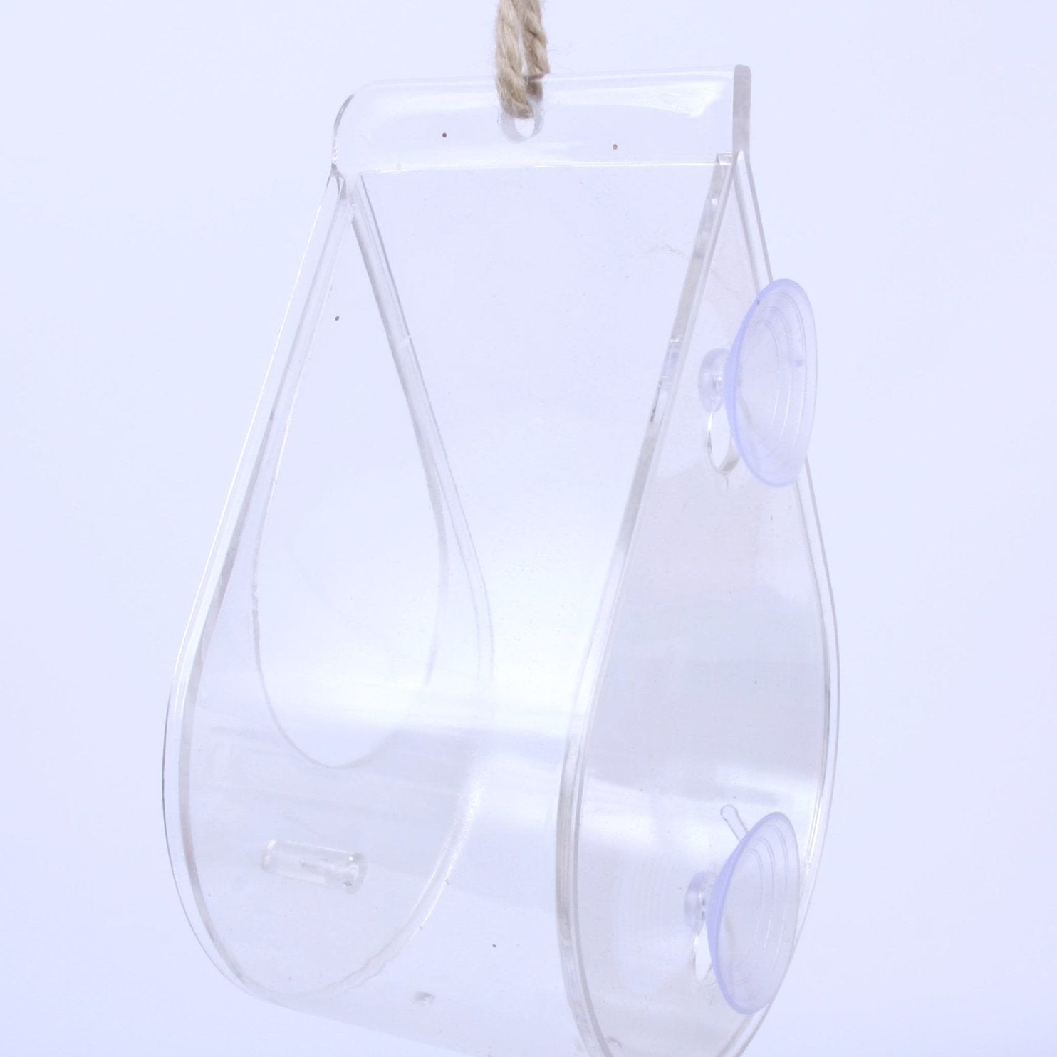 Dewdrop Window Bird Feeder - The Irish Gardener Store Transparent dewdrop-shaped window bird feeder, made of clear acrylic, featuring two suction cups for secure window attachment, lightweight and modern design, rope accent for optional hanging, empty open tray design, minimalistic bird feeder style