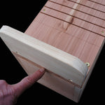 Red Squirrel Nest Box - The Irish Gardener Store Red Squirrel Nest Box, wooden construction with natural finish,circular entrance hole, horizontal grooves for climbing, weather-resistant design, spacious interior, eco-friendly wildlife shelter, ideal for red squirrels, located in a natural outdoor setting, sustainable conservation habitat