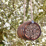 The Bee Barrel - The Irish Gardener Store rustic wooden bee barrel, hanging pollinator habitat, bamboo nesting tubes, eco-friendly design, bee nesting barrel, garden decoration for pollinators, sustainable bee shelter, wildlife garden accessory, wooden barrel bee home, rope hanging bee habitat