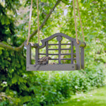 Timeless Lutyens Swingseat Bird Feeder - The Irish Gardener Store Timeless Lutyens Swingseat Bird Feeder hanging in a garden, wooden swing design for feeding birds, durable rope suspension, classic Lutyens-inspired style, weather-resistant bird feeder, decorative garden bird feeder, close-up of wooden swing bird feeder, perfect for small birds like sparrows and finches, garden wildlife attraction, stylish bird feeder for outdoor spaces