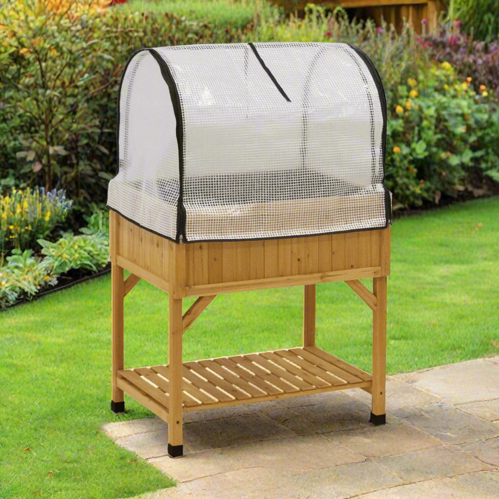 
A wooden raised garden bed with a clear protective greenhouse cover, featuring a mesh design and zippered opening, sturdy wooden frame with a slatted lower shelf for storage, compact and functional design ideal for gardening in smaller spaces or extending the growing season.