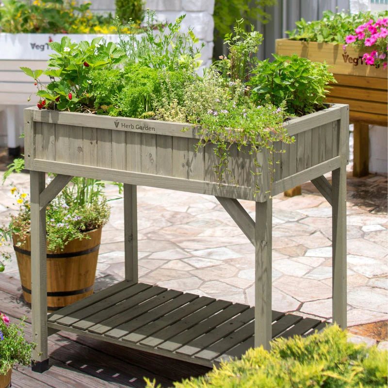 Image of the VegTrug Herb Garden showcasing its raised wooden design with eight pockets for growing fresh herbs in a patio setting.