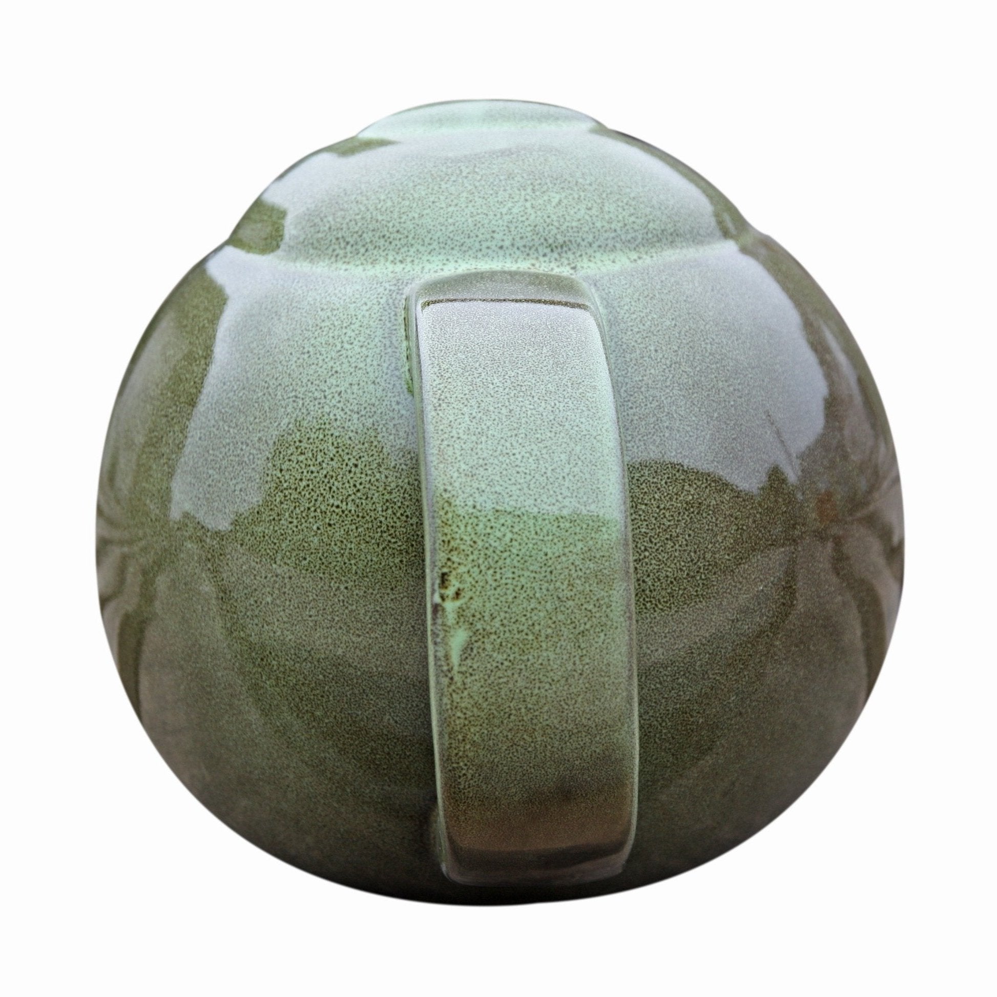 Robin Teapot Nester - The Irish Gardener Store Robin Teapot Nester, ceramic teapot-shaped birdhouse, green glaze finish, rounded design, open-top entrance, durable and weatherproof material, eco-friendly bird shelter, ideal for robins and small birds, decorative garden feature, unique wildlife habitat, standalone view