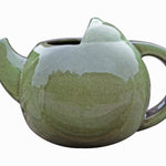 Robin Teapot Nester - The Irish Gardener Store  Robin Teapot Nester, ceramic teapot-shaped birdhouse, green glaze finish, rounded design, open-top entrance, durable and weatherproof material, eco-friendly bird shelter, ideal for robins and small birds, decorative garden feature, unique wildlife habitat, standalone view