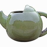Robin Teapot Nester - The Irish Gardener Store  Robin Teapot Nester, ceramic teapot-shaped birdhouse, green glaze finish, rounded design, open-top entrance, durable and weatherproof material, eco-friendly bird shelter, ideal for robins and small birds, decorative garden feature, unique wildlife habitat, standalone view