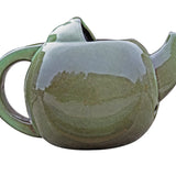 Robin Teapot Nester - The Irish Gardener Store Robin Teapot Nester, ceramic teapot-shaped birdhouse, green glaze finish, rounded design, open-top entrance, durable and weatherproof material, eco-friendly bird shelter, ideal for robins and small birds, decorative garden feature, unique wildlife habitat, standalone view