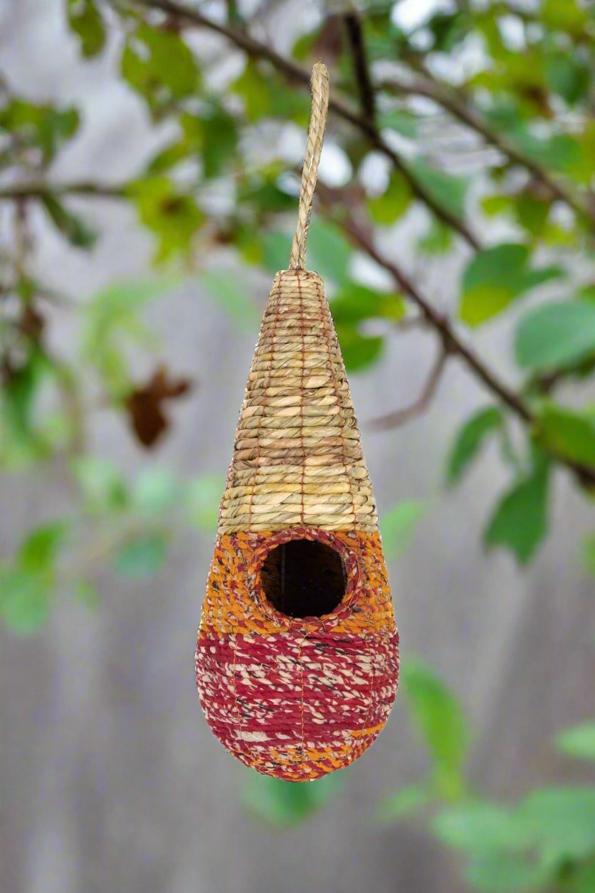 Tahera - Artisan Bird Nester - The Irish Gardener Store handcrafted Tahera Artisan Bird Nester, eco-friendly woven bird house, vibrant natural fiber bird nester, sustainable bird shelter with colorful design, cone-shaped hanging bird nester, rustic garden birdhouse, artisan-crafted nesting habitat